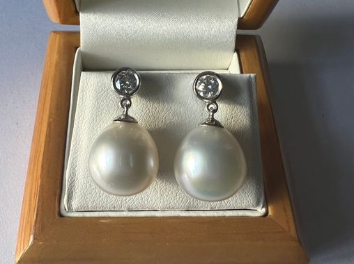 SOLD - A pair of pre-owned Souths Seas cultured pearl and diamond earrings